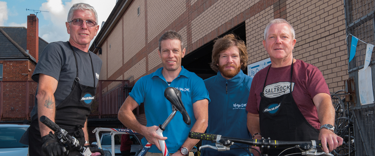 gents stood with bikes