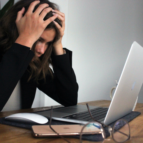 A woman frustrated with the computer process