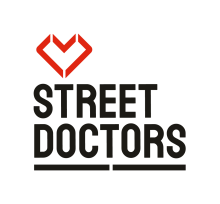 StreetDoctors Logo: Red angular heart above words in black capitals reading STREETDOCTORS with a broken black underline